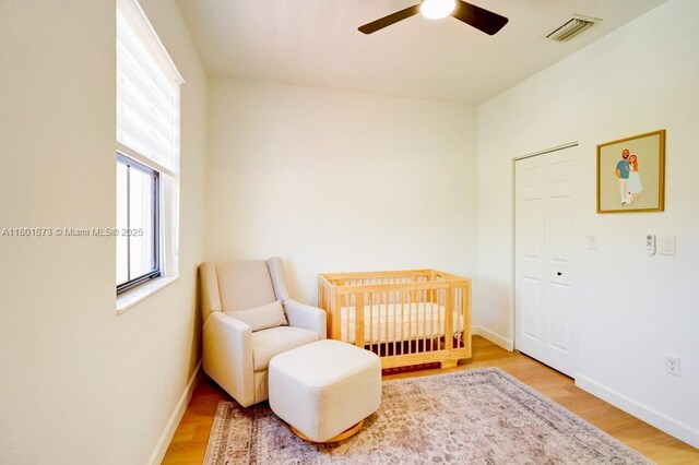 10602 W 33rd Way, Hialeah, FL 33018 - bedroom with wood finished floors, baseboards, and a ceiling fan