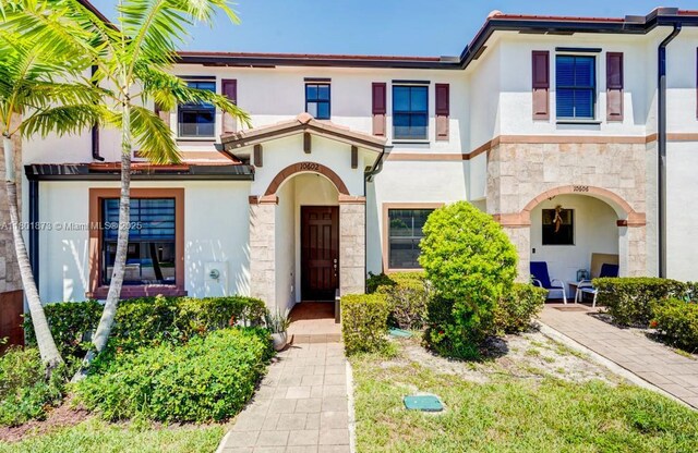 10602 W 33rd Way, Hialeah, FL 33018 - townhome / multi-family property with stucco siding and stone siding