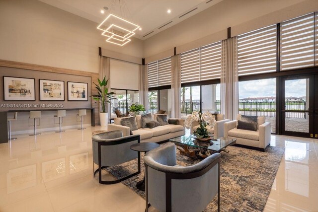 10602 W 33rd Way, Hialeah, FL 33018 - community lobby with a high ceiling and a water view