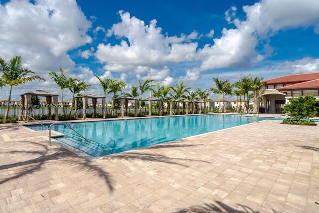 10602 W 33rd Way, Hialeah, FL 33018 - community pool featuring a gazebo and a patio area