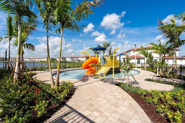 10602 W 33rd Way, Hialeah, FL 33018 - community jungle gym featuring a pool and a water play area
