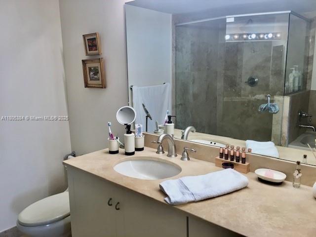 3232 SW 22nd Ter Unit 1303, Miami, FL 33145 - full bath featuring a stall shower, toilet, and vanity