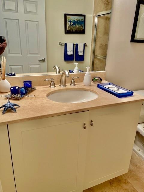 3232 SW 22nd Ter Unit 1303, Miami, FL 33145 - full bathroom with a stall shower, vanity, and tile patterned floors