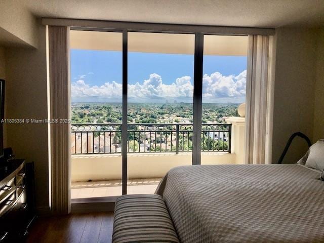 3232 SW 22nd Ter Unit 1303, Miami, FL 33145 - bedroom with dark wood-style flooring and floor to ceiling windows