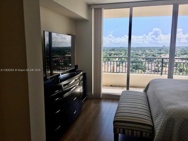 3232 SW 22nd Ter Unit 1303, Miami, FL 33145 - bedroom featuring dark wood-style floors