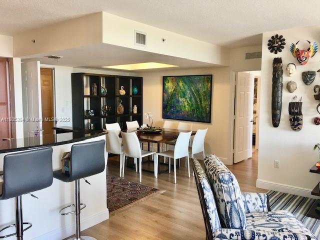 3232 SW 22nd Ter Unit 1303, Miami, FL 33145 - dining space featuring light wood-style flooring and baseboards