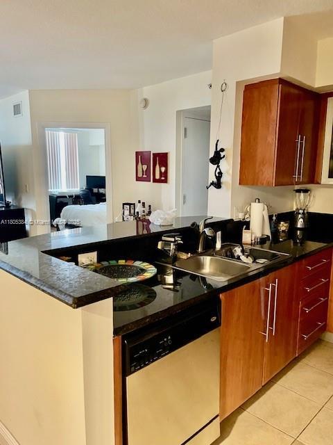 3232 SW 22nd Ter Unit 1303, Miami, FL 33145 - kitchen with dishwashing machine, a sink, light tile patterned flooring, and open floor plan