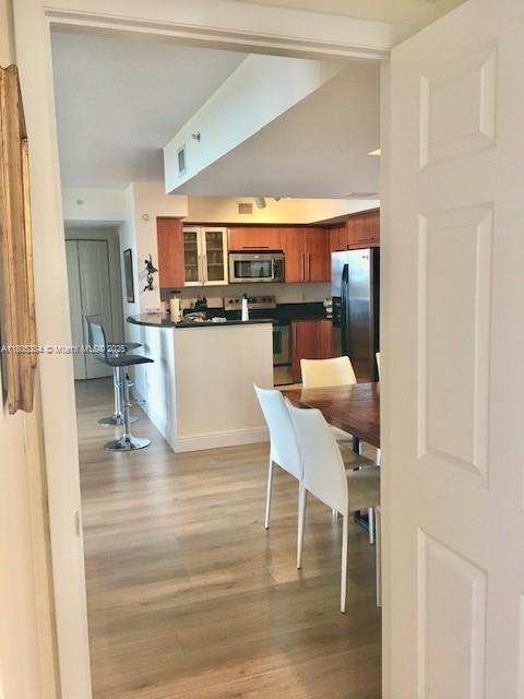 3232 SW 22nd Ter Unit 1303, Miami, FL 33145 - dining area featuring light wood finished floors