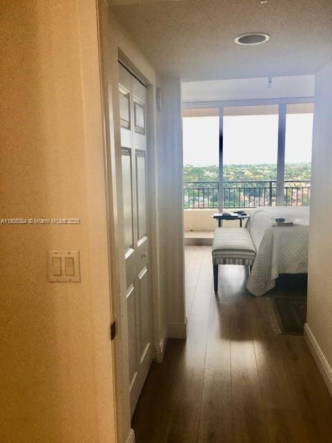 3232 SW 22nd Ter Unit 1303, Miami, FL 33145 - hall with plenty of natural light, hardwood / wood-style floors, and baseboards