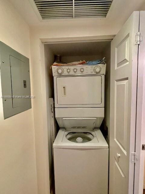 3232 SW 22nd Ter Unit 1303, Miami, FL 33145 - clothes washing area featuring stacked washer and clothes dryer and electric panel