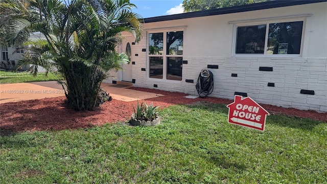3601 N 72nd Ave, Hollywood, FL 33024 - back of property with crawl space, a yard, and stucco siding