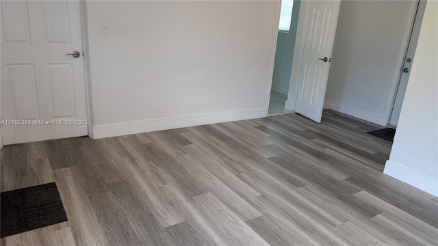 3601 N 72nd Ave, Hollywood, FL 33024 - unfurnished room featuring baseboards and wood finished floors