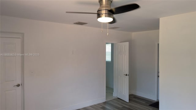 3601 N 72nd Ave, Hollywood, FL 33024 - unfurnished bedroom with wood finished floors, baseboards, and a ceiling fan