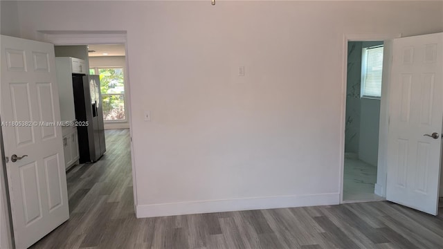 3601 N 72nd Ave, Hollywood, FL 33024 - unfurnished room featuring dark wood-style floors and baseboards