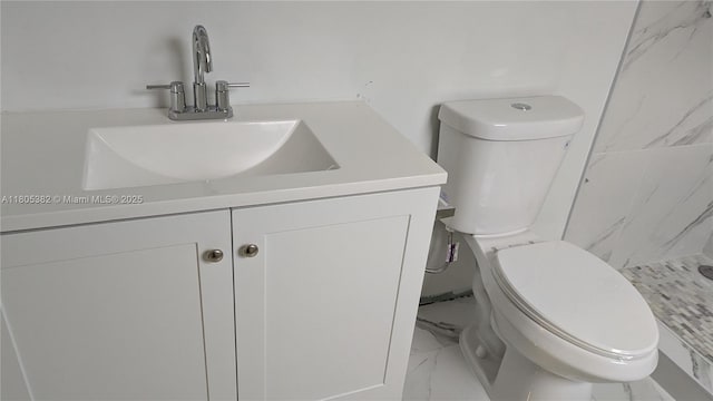 3601 N 72nd Ave, Hollywood, FL 33024 - bathroom featuring marble look tiles, vanity, toilet, and a shower