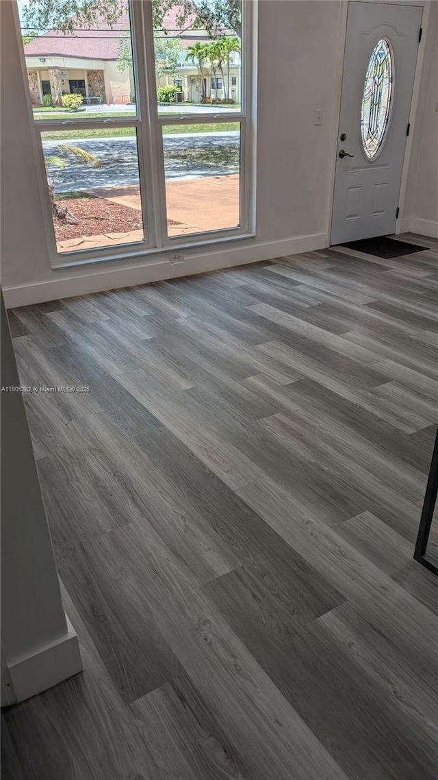 3601 N 72nd Ave, Hollywood, FL 33024 - entryway featuring dark wood-style flooring and baseboards