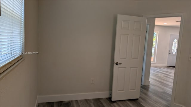 3601 N 72nd Ave, Hollywood, FL 33024 - empty room featuring dark wood-type flooring and baseboards