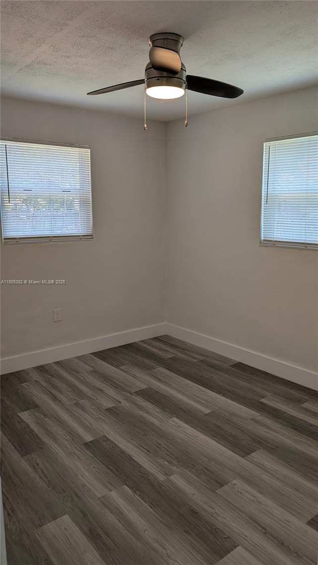 3601 N 72nd Ave, Hollywood, FL 33024 - unfurnished room with healthy amount of natural light, a textured ceiling, dark wood finished floors, and ceiling fan