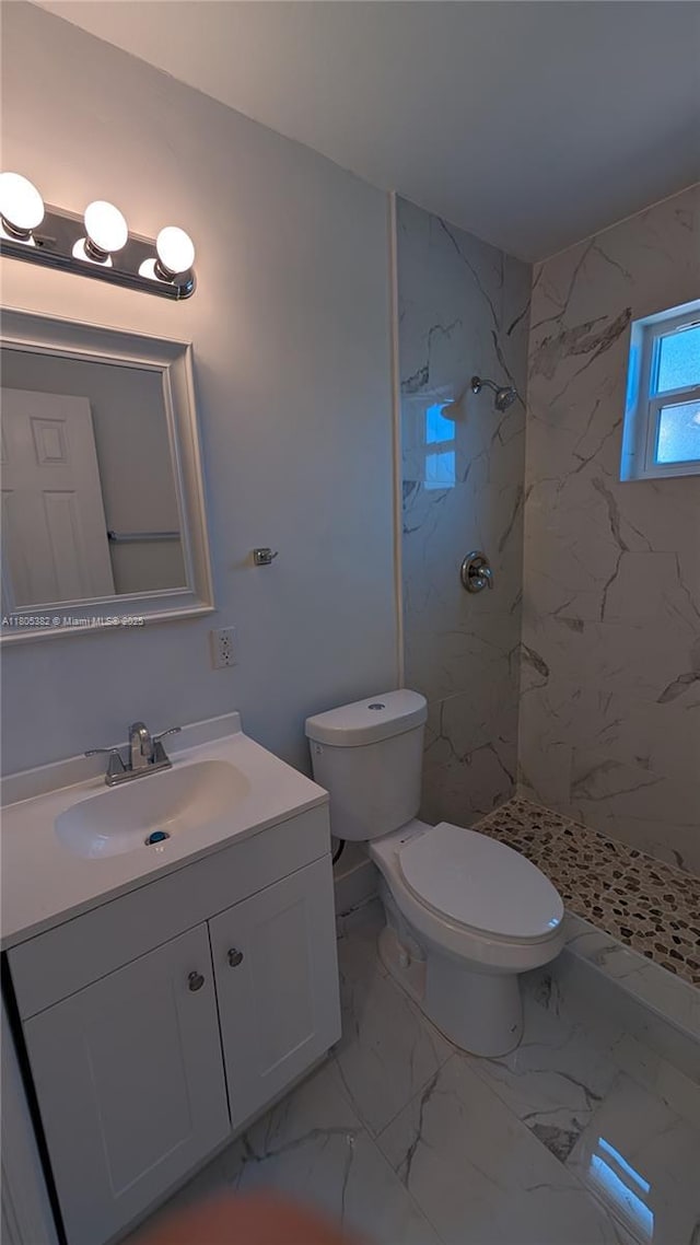 3601 N 72nd Ave, Hollywood, FL 33024 - bathroom with toilet, a marble finish shower, vanity, and marble look tiles