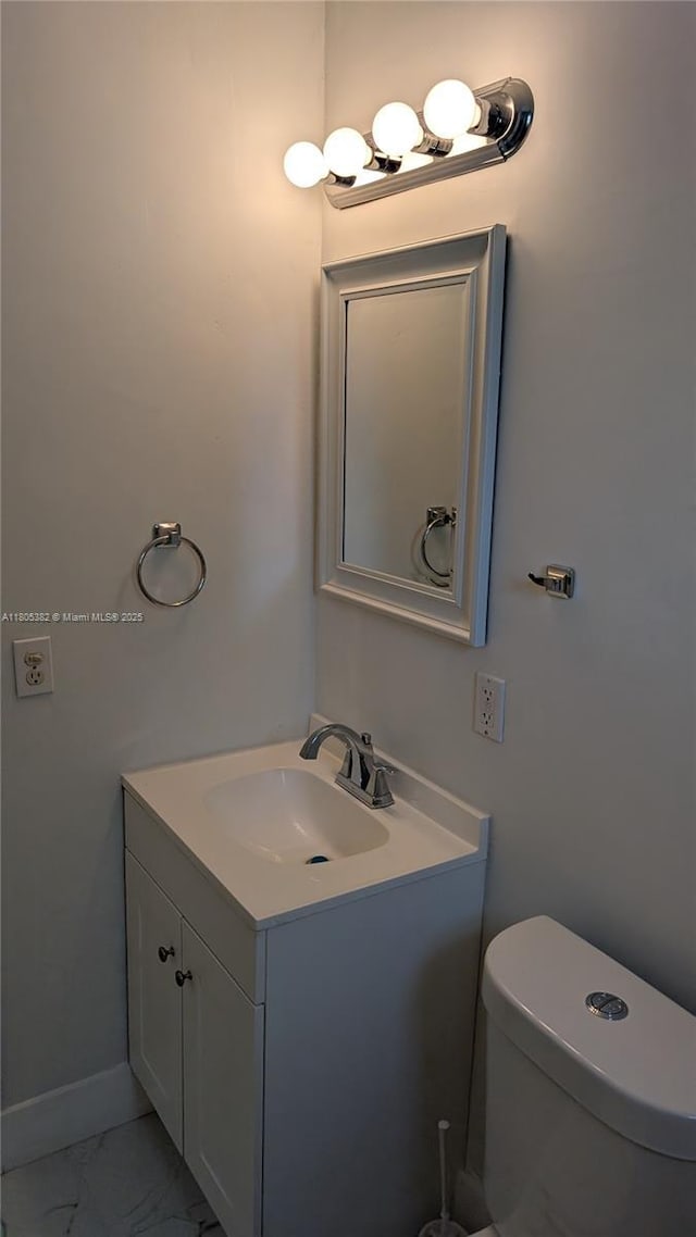3601 N 72nd Ave, Hollywood, FL 33024 - half bath with marble finish flooring, vanity, toilet, and baseboards