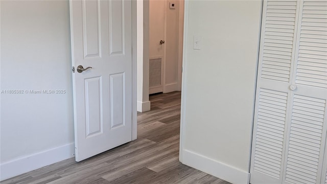 3601 N 72nd Ave, Hollywood, FL 33024 - hallway featuring wood finished floors and baseboards