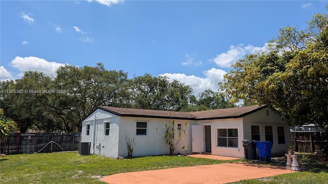 3601 N 72nd Ave, Hollywood, FL 33024 - rear view of property with central AC and stucco siding