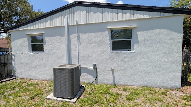 3601 N 72nd Ave, Hollywood, FL 33024 - view of side of home featuring central air condition unit and stucco siding