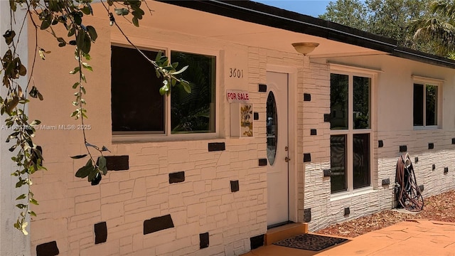 3601 N 72nd Ave, Hollywood, FL 33024 - property entrance featuring stone siding