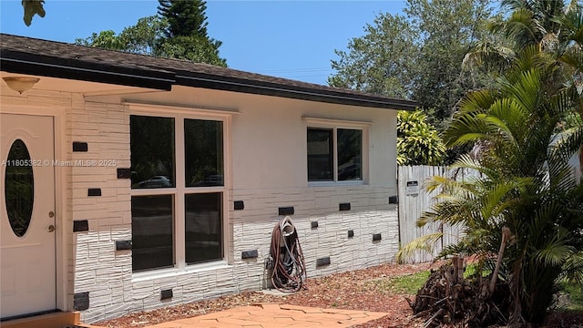 3601 N 72nd Ave, Hollywood, FL 33024 - rear view of house featuring stone siding