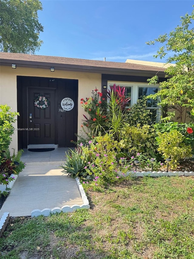 9481 W Elm Ln, Miramar, FL 33025 - view of exterior entry featuring stucco siding