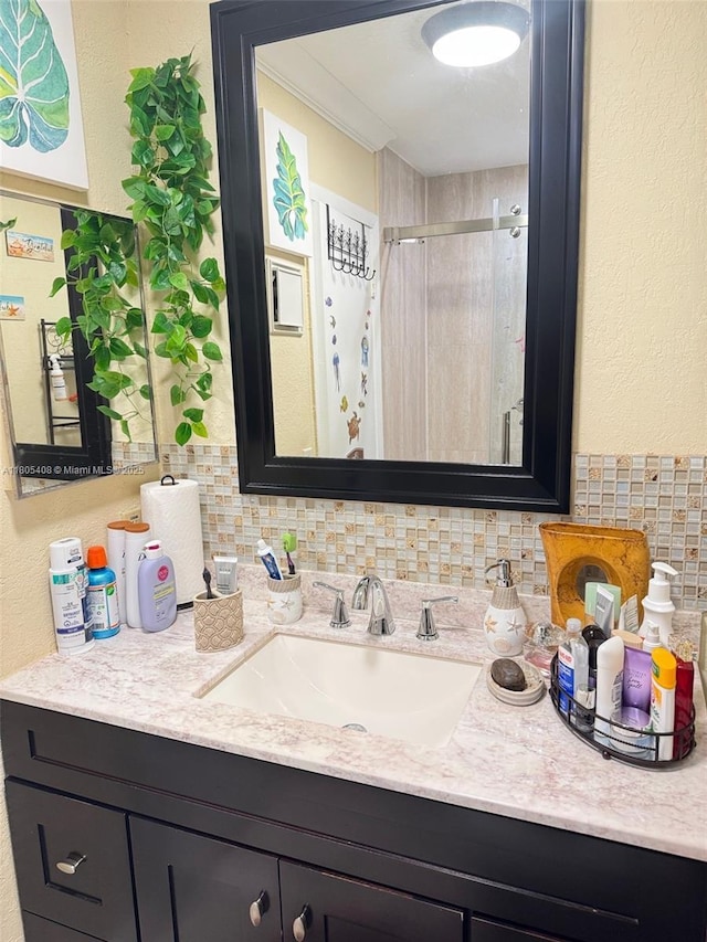 9481 W Elm Ln, Miramar, FL 33025 - full bath with decorative backsplash, vanity, a shower stall, and a textured wall