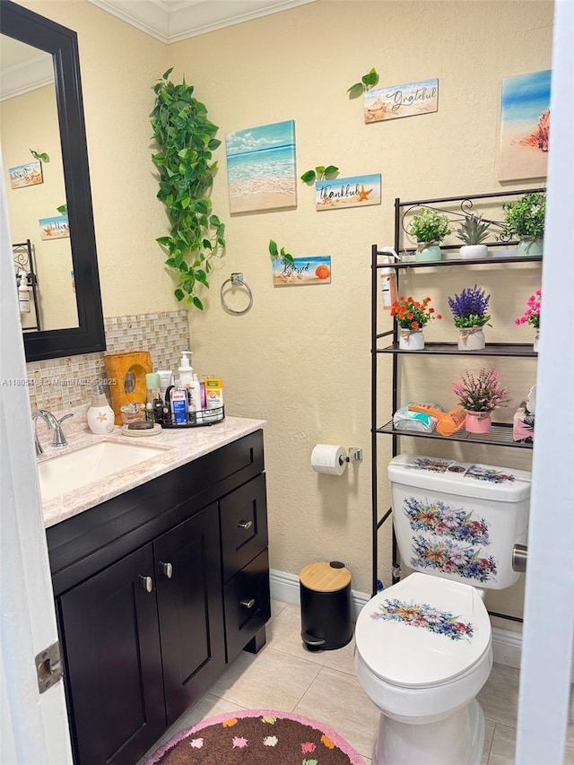9481 W Elm Ln, Miramar, FL 33025 - half bathroom with crown molding, vanity, toilet, tile patterned floors, and baseboards
