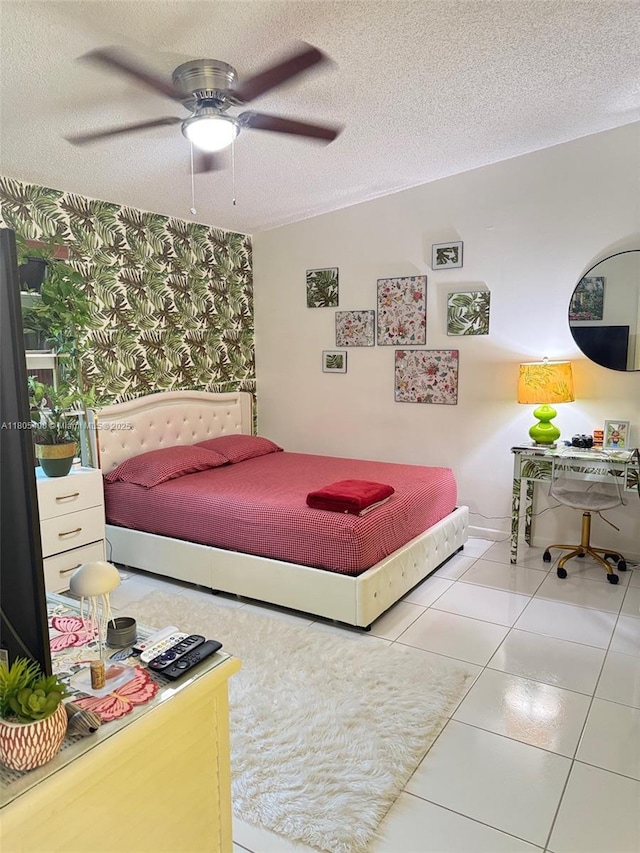 9481 W Elm Ln, Miramar, FL 33025 - bedroom with wallpapered walls, a textured ceiling, tile patterned floors, and ceiling fan