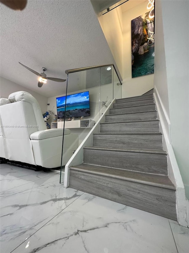 2207 SE 23rd Ave Unit 2207, Homestead, FL 33035 - stairs with a textured ceiling, ceiling fan, and marble finish flooring