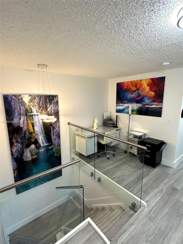 2207 SE 23rd Ave Unit 2207, Homestead, FL 33035 - office space featuring wood finished floors, a textured ceiling, and baseboards