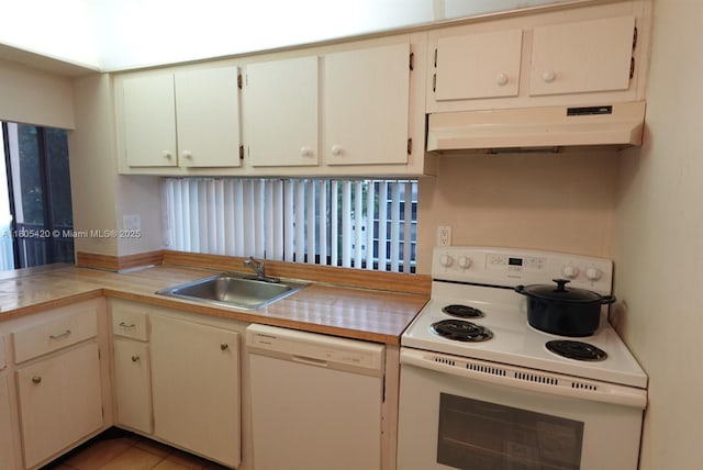 17011 N Bay Rd Unit 408, Sunny Isles Beach, FL 33160 - kitchen featuring white appliances, under cabinet range hood, a sink, and light countertops
