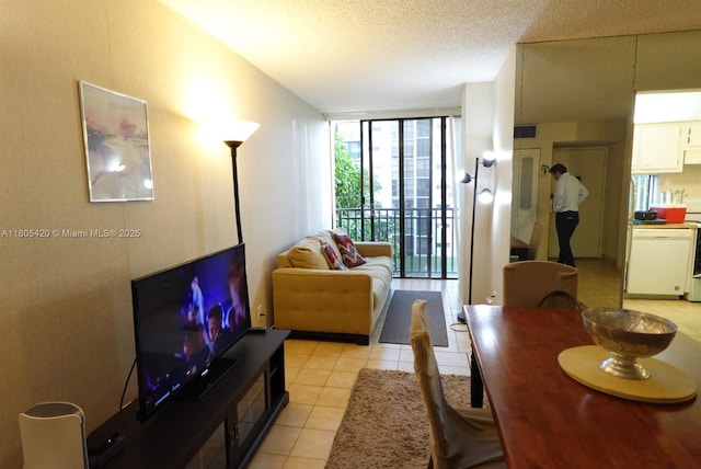 17011 N Bay Rd Unit 408, Sunny Isles Beach, FL 33160 - living area featuring light tile patterned flooring, floor to ceiling windows, and a textured ceiling