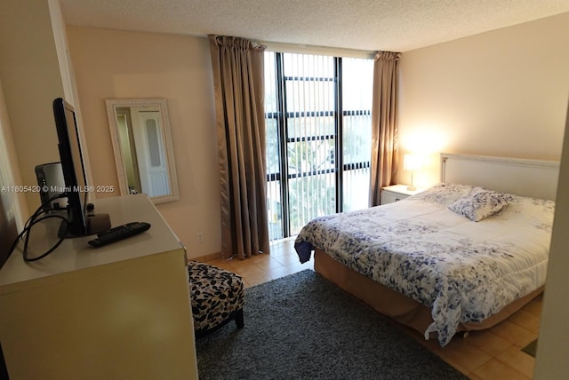 17011 N Bay Rd Unit 408, Sunny Isles Beach, FL 33160 - bedroom with access to outside, light tile patterned floors, and a wall of windows