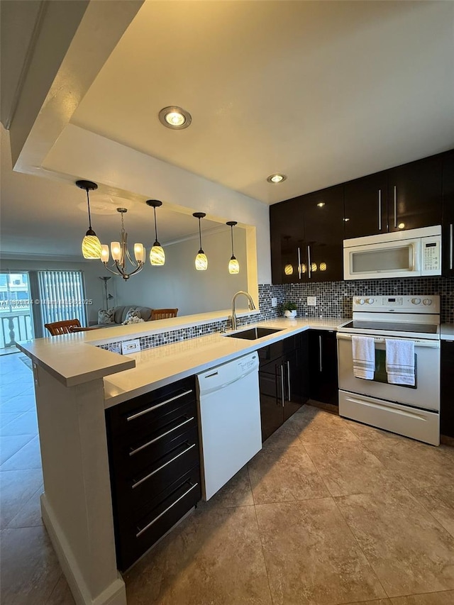 218 NE 12th Ave Unit 503, Hallandale Beach, FL 33009 - kitchen featuring white appliances, a sink, dark cabinets, backsplash, and recessed lighting