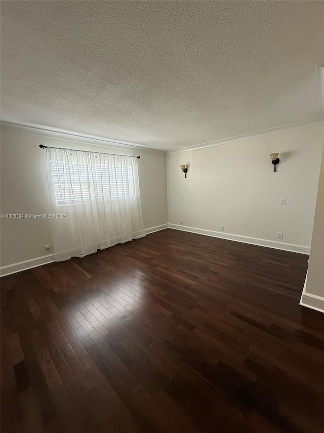 218 NE 12th Ave Unit 503, Hallandale Beach, FL 33009 - empty room with a textured ceiling, dark wood finished floors, baseboards, and ornamental molding