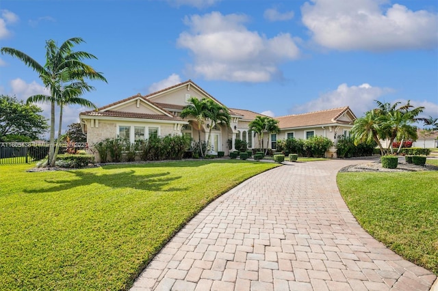 5630 N Sterling Ranch Dr, Davie, FL 33314 - view of front of home featuring curved driveway and a tile roof
