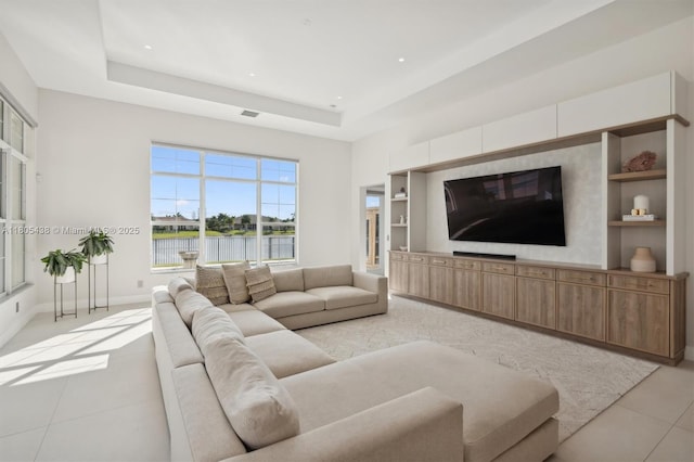 5630 N Sterling Ranch Dr, Davie, FL 33314 - living area with light tile patterned floors, a tray ceiling, baseboards, built in shelves, and recessed lighting