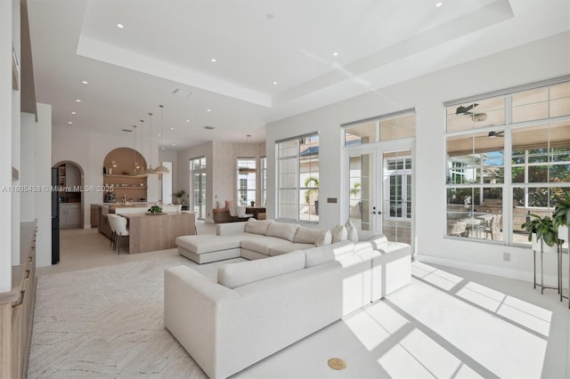 5630 N Sterling Ranch Dr, Davie, FL 33314 - living area with a raised ceiling, french doors, recessed lighting, arched walkways, and ceiling fan