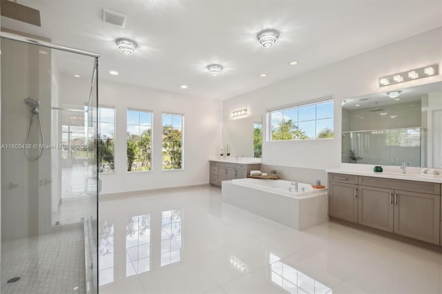 5630 N Sterling Ranch Dr, Davie, FL 33314 - bathroom featuring a stall shower, two vanities, a bath, tile patterned floors, and recessed lighting