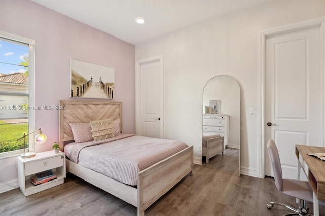 5630 N Sterling Ranch Dr, Davie, FL 33314 - bedroom featuring wood finished floors, multiple windows, baseboards, and recessed lighting