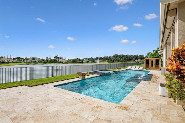 5630 N Sterling Ranch Dr, Davie, FL 33314 - view of pool with a patio, a pool with connected hot tub, a fenced backyard, and a water view