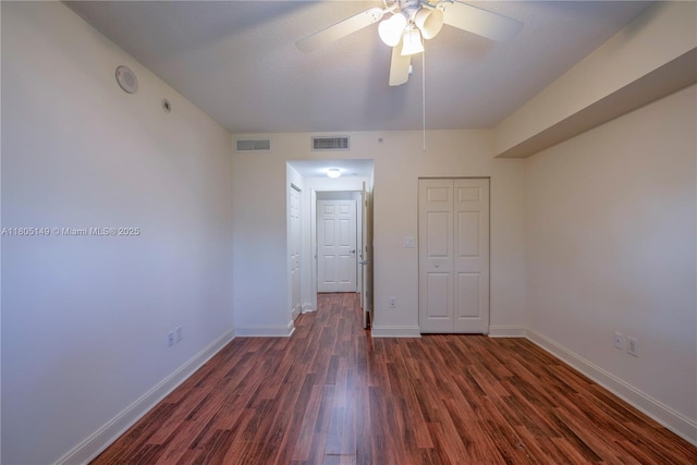 510 NW 84th Ave Unit 303, Plantation, FL 33324 - unfurnished bedroom with dark wood-style flooring, baseboards, a closet, and ceiling fan