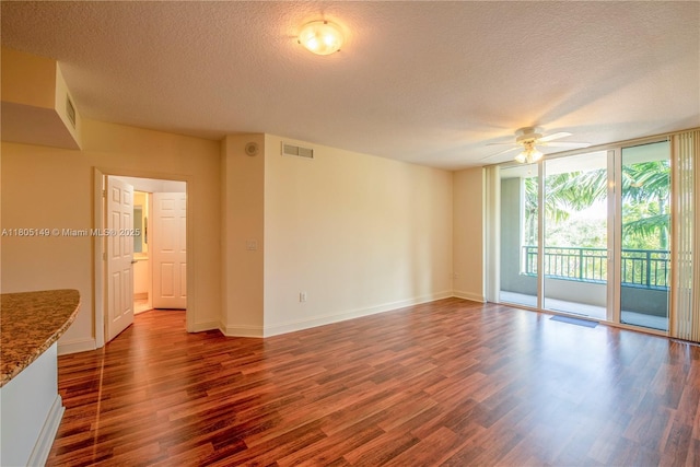 510 NW 84th Ave Unit 303, Plantation, FL 33324 - empty room with a textured ceiling, a ceiling fan, wood finished floors, floor to ceiling windows, and baseboards