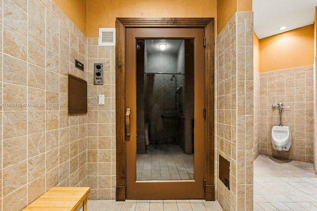 510 NW 84th Ave Unit 303, Plantation, FL 33324 - full bath featuring tile walls, a shower, and tile patterned flooring