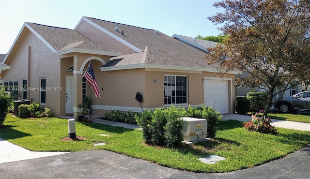 475 SE 20th Ln, Homestead, FL 33033 - view of front of home featuring a shingled roof, an attached garage, stucco siding, and a front lawn